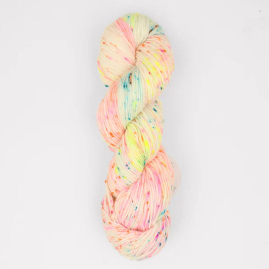 Multicolored skein of yarn on a white background